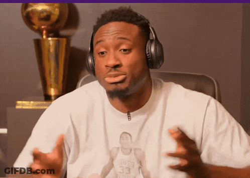 A Man Wearing Headphones And A Shirt With A Picture Of A Basketball Player With The Number 33 GIF