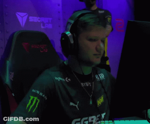 A Man Wearing Headphones And A Shirt With Logitech On It GIF