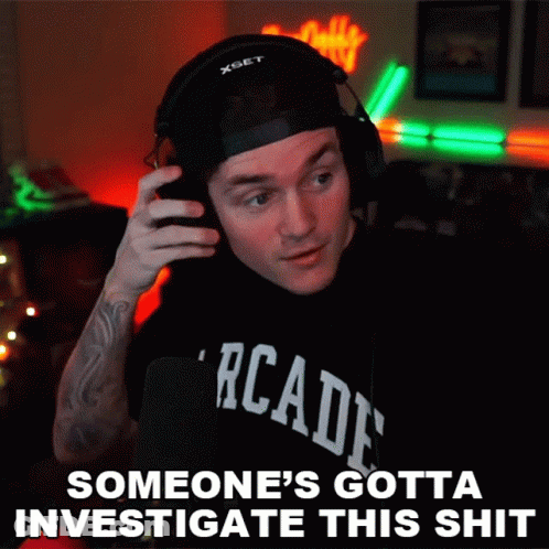 A Man Wearing Headphones And A T-Shirt That Says Arcade GIF