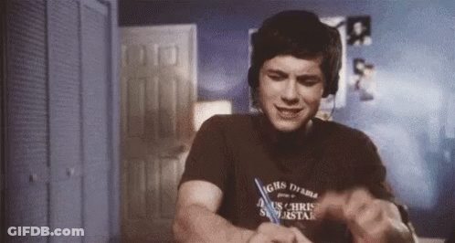A Man Wearing Headphones And A T-Shirt That Says ' Chris ' On It GIF