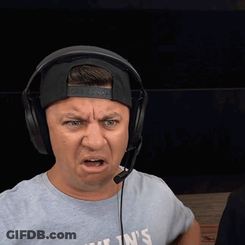 A Man Wearing Headphones And A T-Shirt That Says Kylin 'S Making A Funny Face GIF