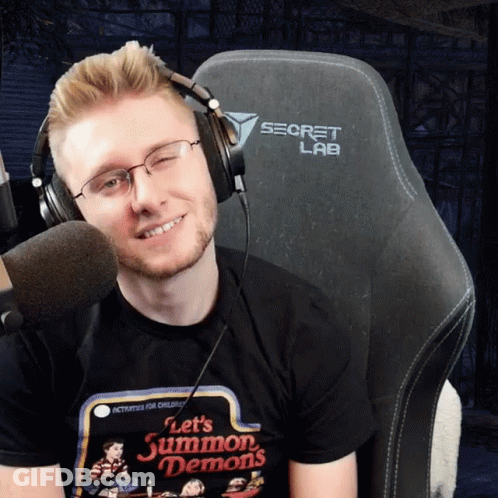 A Man Wearing Headphones And A T-Shirt That Says Let 'S Summon Demons GIF