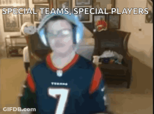 A Man Wearing Headphones And A Texans Jersey With The Number 7 GIF