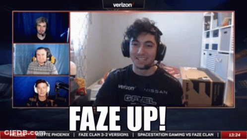 A Man Wearing Headphones And A Verizon Shirt Says Faze Up On The Screen GIF