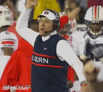 A Man Wearing Headphones And A Vest That Says Auburn On It GIF