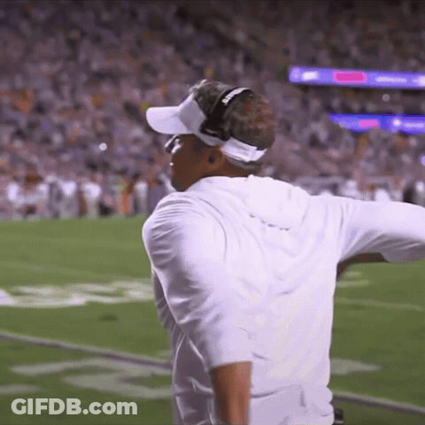 A Man Wearing Headphones And A Visor That Says Georgia On It GIF