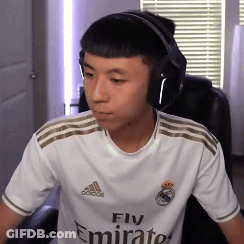 A Man Wearing Headphones And A White Fly Emirates Shirt GIF