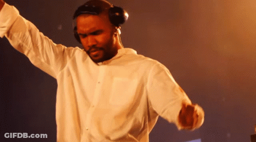 A Man Wearing Headphones And A White Shirt Dancing GIF