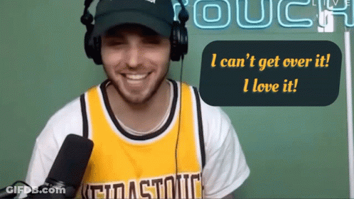 A Man Wearing Headphones And A Yellow Jersey Says I Can 'T Get Over It And I Love It GIF