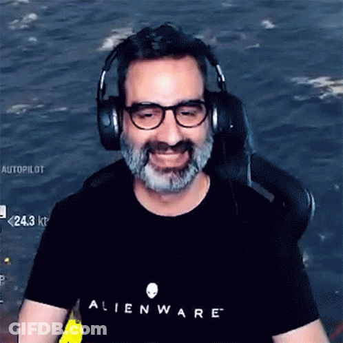 A Man Wearing Headphones And An Alienware Shirt GIF