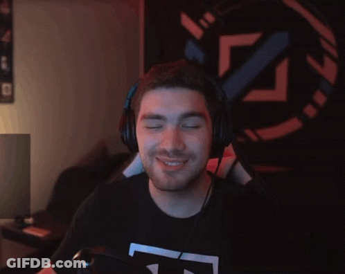 A Man Wearing Headphones And An Under Armour Shirt GIF