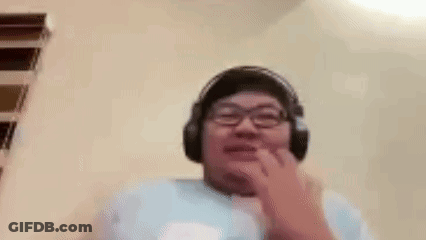A Man Wearing Headphones And Glasses Is Making A Funny Face With His Mouth Open . GIF
