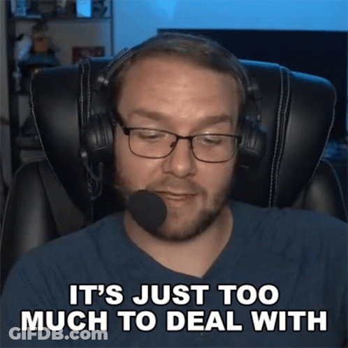 A Man Wearing Headphones And Glasses Is Sitting In A Chair And Says It 'S Just Too Much To Deal With GIF