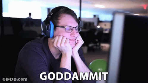 A Man Wearing Headphones And Glasses Is Sitting In Front Of A Computer With The Words Goddammit Written On The Screen GIF