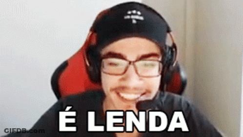 A Man Wearing Headphones And Glasses Is Smiling While Sitting In A Chair And Says E Lenda . GIF