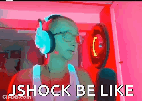 A Man Wearing Headphones And Glasses Is Standing In Front Of A Microphone And Says Jshock Be Like . GIF