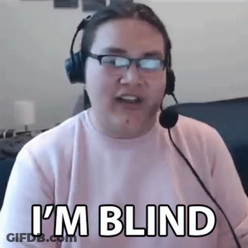A Man Wearing Headphones And Glasses Is Talking Into A Microphone . GIF