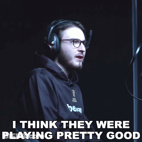A Man Wearing Headphones And Glasses Says " I Think They Were Playing Pretty Good " In A Dark Room GIF
