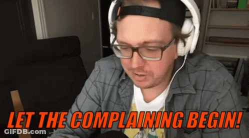 A Man Wearing Headphones And Glasses Says " Let The Complaining Begin " GIF
