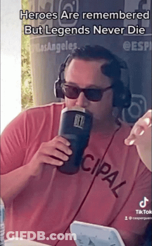 A Man Wearing Headphones And Sunglasses Drinking From A Yeti Cup GIF