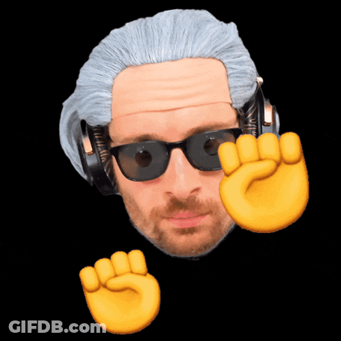 A Man Wearing Headphones And Sunglasses Has A Fist Up In The Air GIF