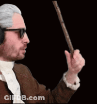 A Man Wearing Headphones And Sunglasses Is Holding A Cane GIF