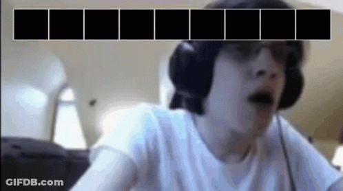A Man Wearing Headphones And Sunglasses Is Looking At A Screen With Black Squares On It GIF