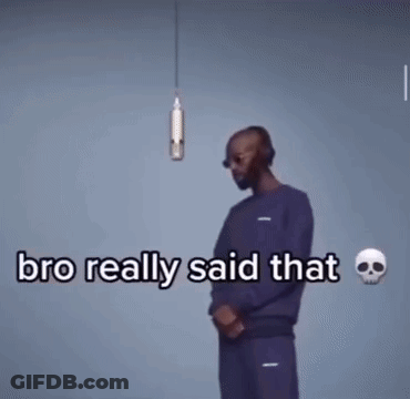 A Man Wearing Headphones And Sunglasses Is Talking Into A Microphone . GIF