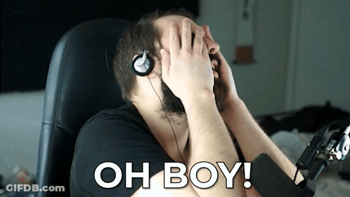 A Man Wearing Headphones Covering His Face With His Hands And The Words Oh Boy Written On The Bottom GIF