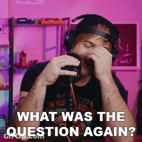 A Man Wearing Headphones Covering His Face With His Hands And The Words What Was The Question Again GIF