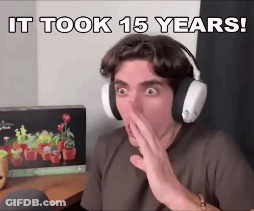 A Man Wearing Headphones Covering His Mouth With His Hand With The Words It Took 15 Years Written Above Him GIF