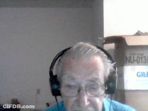 A Man Wearing Headphones Has A License Plate That Reads Nu-013A GIF