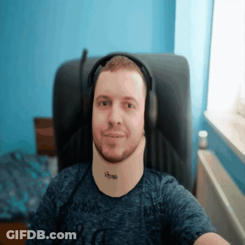 A Man Wearing Headphones Has A Tattoo On His Neck That Reads Xtreme GIF