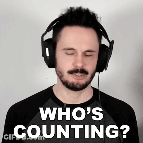 A Man Wearing Headphones Has His Eyes Closed And Says Who 'S Counting GIF