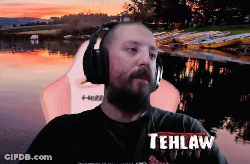A Man Wearing Headphones Has Tehlaw Written On His T-Shirt GIF