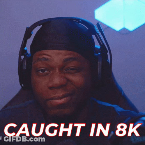 A Man Wearing Headphones Has The Words Caught In 8K Above Him GIF