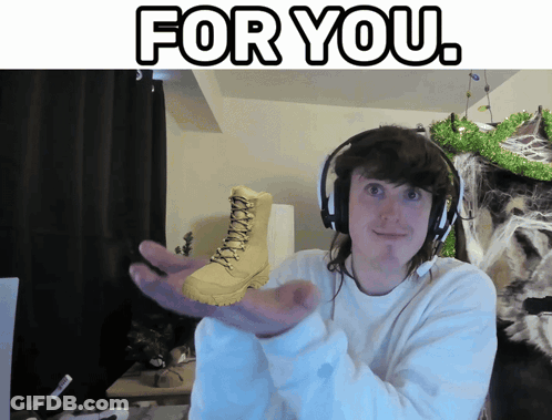 A Man Wearing Headphones Holds A Pair Of Boots In His Hand With The Words " For You " Above Him GIF