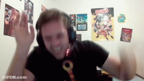 Man With Headphones In Front Of Naruto Posters GIF
