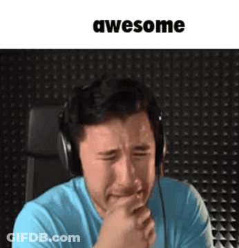 A Man Wearing Headphones Is Crying While Holding His Hand To His Mouth . GIF