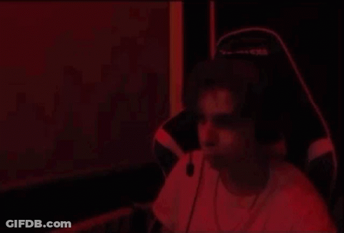 Man Dancing With Headphones In Red Light GIF