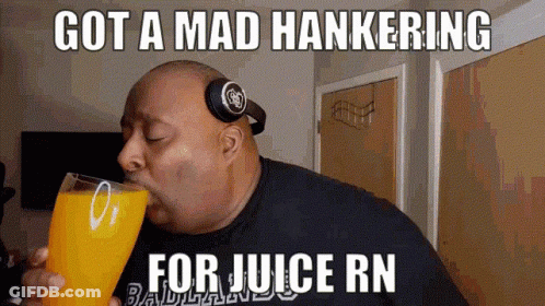 A Man Wearing Headphones Is Drinking A Glass Of Orange Juice With The Caption Got A Mad Hankering For Juice Rn GIF