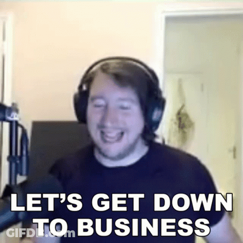 A Man Wearing Headphones Is Laughing And Saying Let 'S Get Down To Business GIF