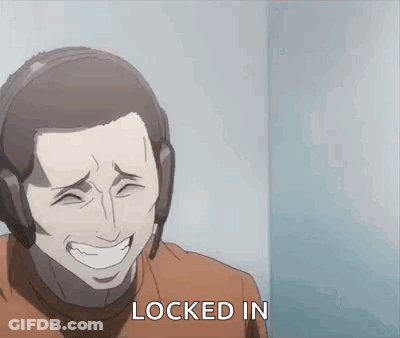 A Man Wearing Headphones Is Laughing And Says `` Locked In '' . GIF