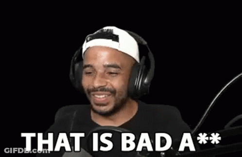 A Man Wearing Headphones Is Laughing In Front Of A Microphone And Says `` That Is Bad A ** '' . GIF