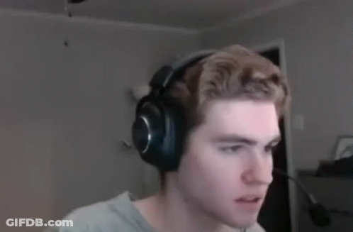A Man Wearing Headphones Is Looking At The Camera In A Blurry Photo . GIF
