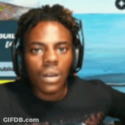 A Man Wearing Headphones Is Looking At The Camera . GIF