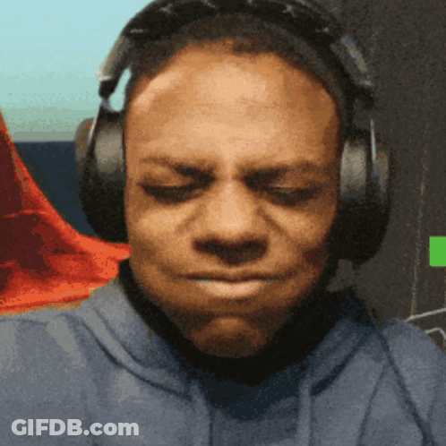 A Man Wearing Headphones Is Making A Face With His Eyes Closed GIF