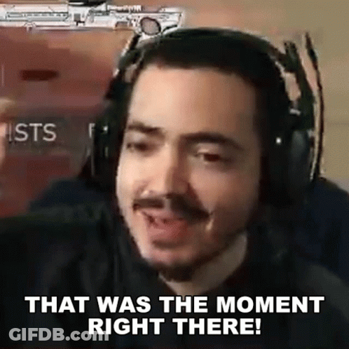 A Man Wearing Headphones Is Making A Funny Face And Saying `` That Was The Moment Right There '' . GIF