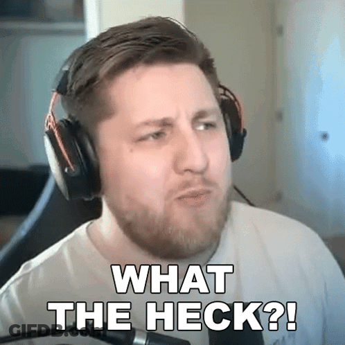 A Man Wearing Headphones Is Making A Funny Face And Says What The Heck ? GIF