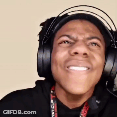 A Man Wearing Headphones Is Making A Funny Face And Smiling . GIF
